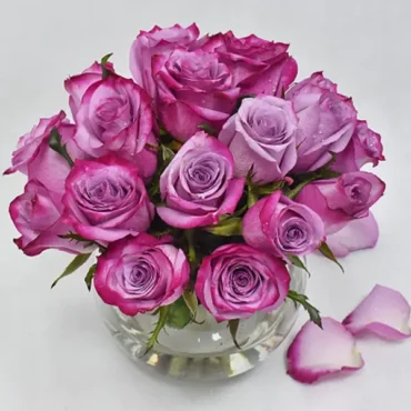 Purple Roses in Glass Bowl
